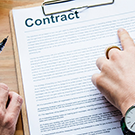 fingers pointing at a contract 