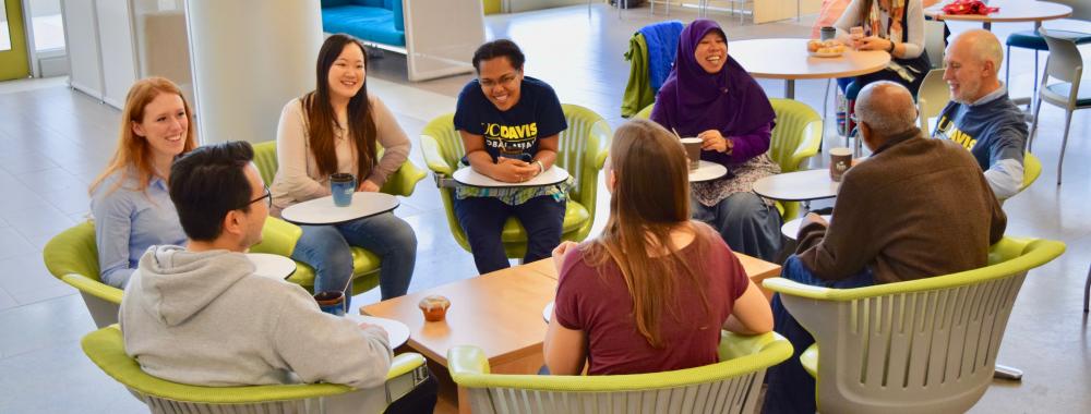 Students and staff and fellows talking