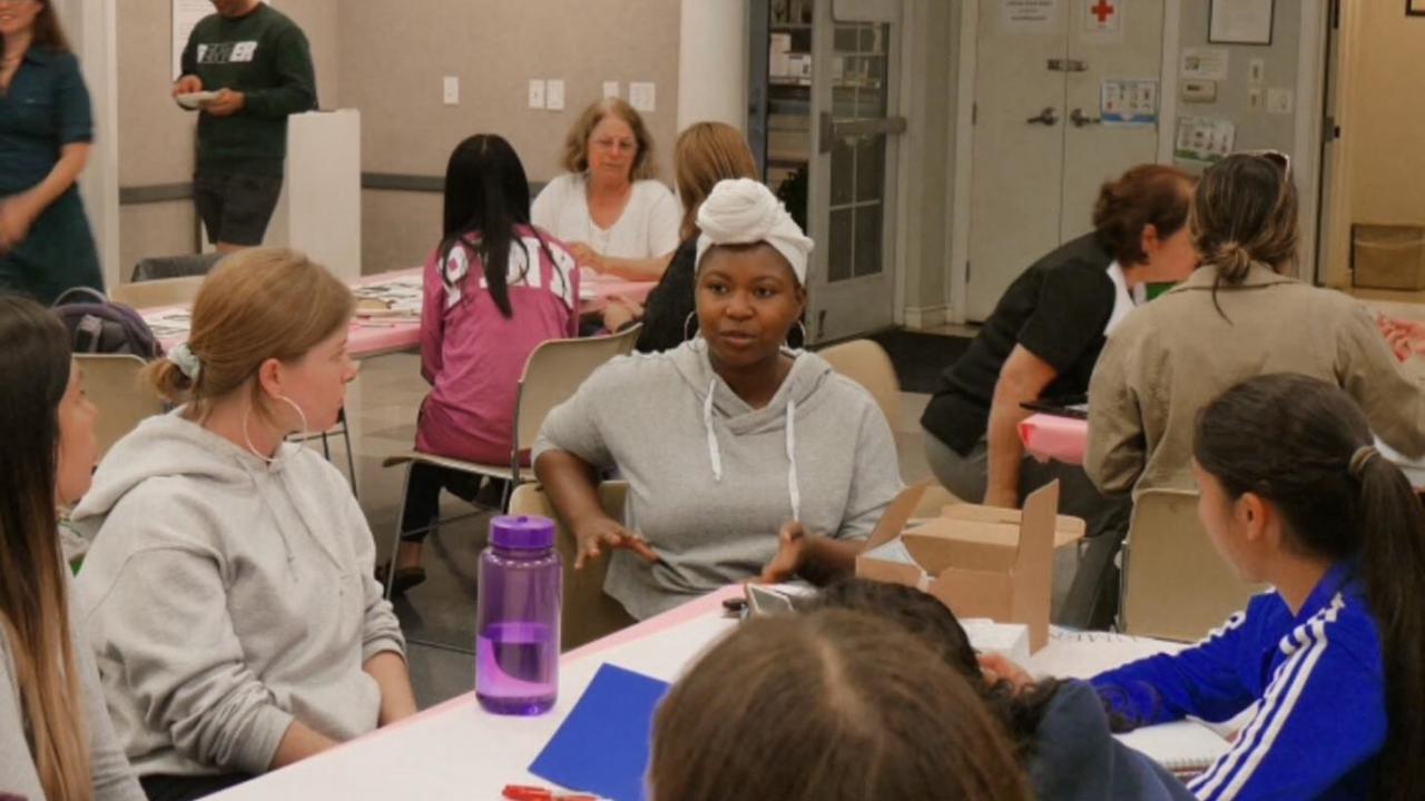 Valencia Scott, center, of the AB540 & Undocumented Student Center at UC Davis, talks about the center’s work during an immigration forum at International House Davis last week. Myra Casillas/Courtesy photo I-House