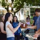 students holding a football