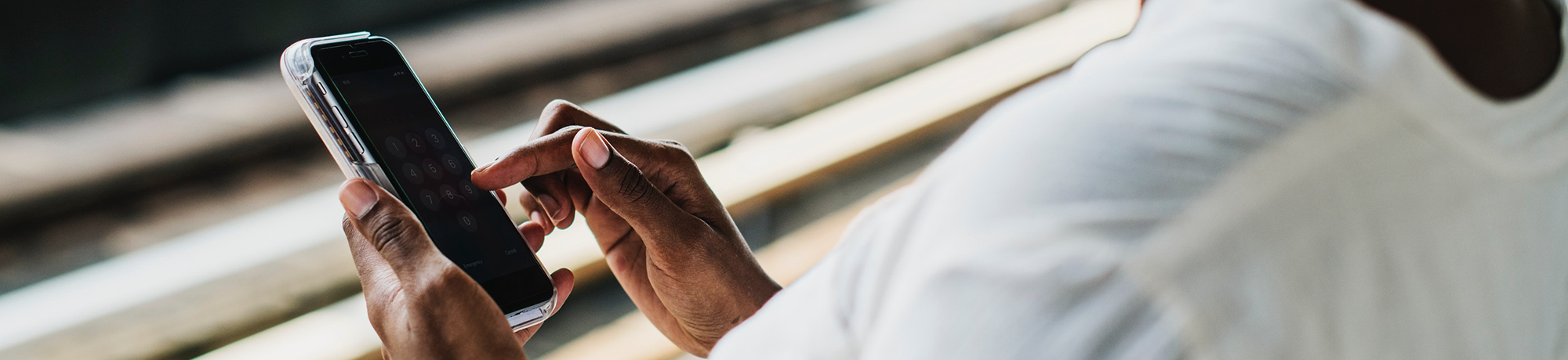 woman holding a cell phone about to dial 