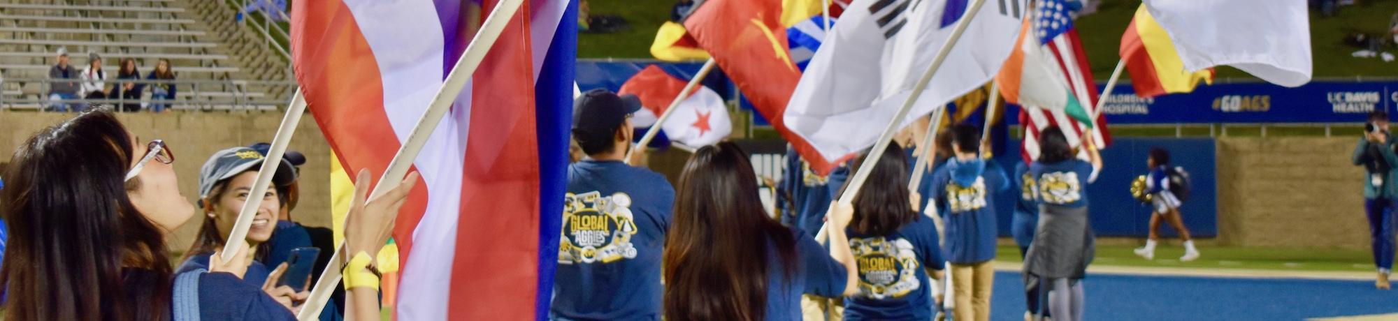 Students with flags on campus