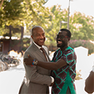 chancellor may shaking hands with a Mandela fellow