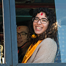 girl smiling on a train