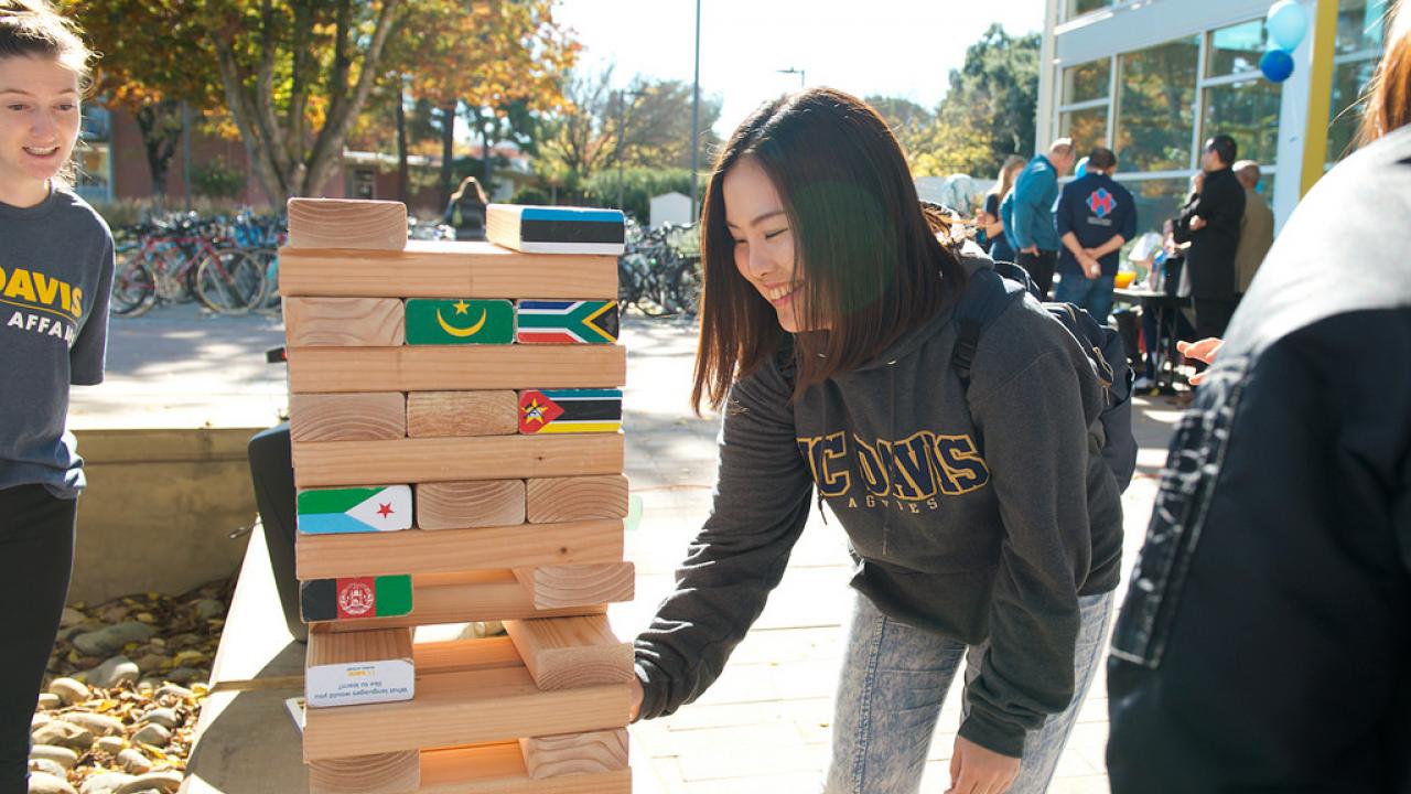 Students playing world Jenga