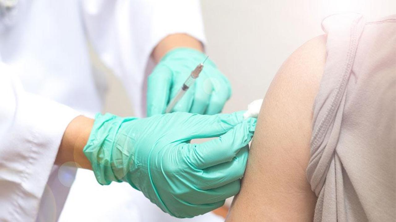Student Health and Counseling Services has vaccination appointments available for students. (Pornpak Khunatorn/Getty Images) hands in gloves giving a shot