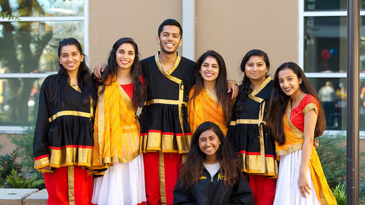 group of men and women in traditional indian clothing