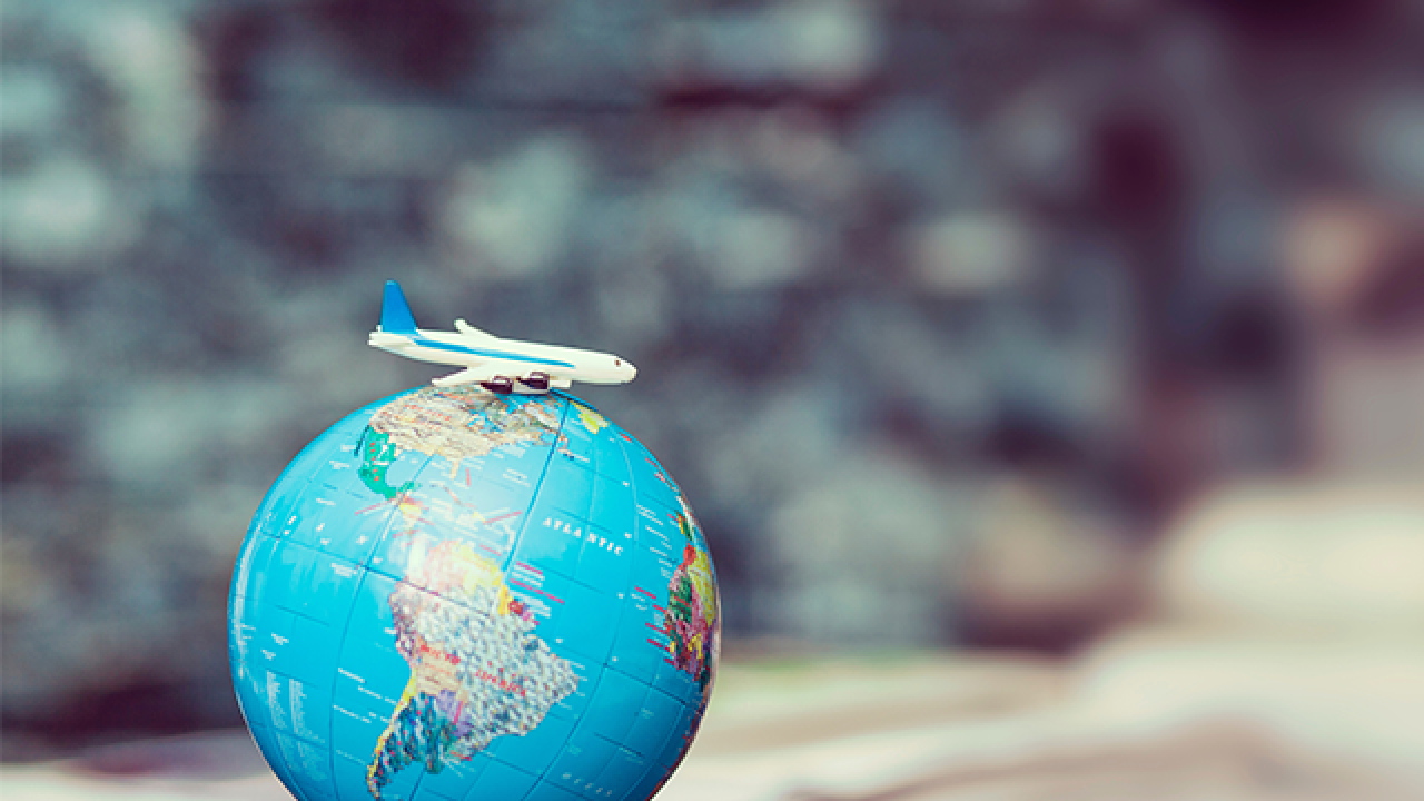 desktop globe with toy plane