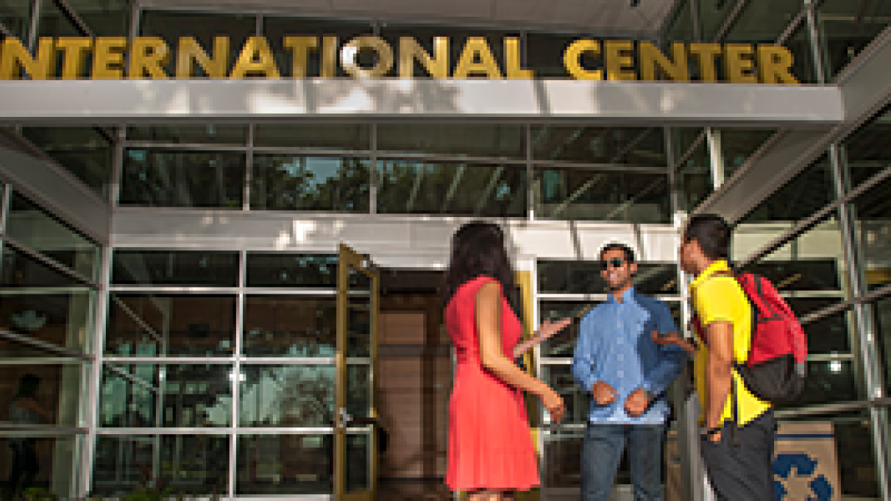 people standing in front of the international center