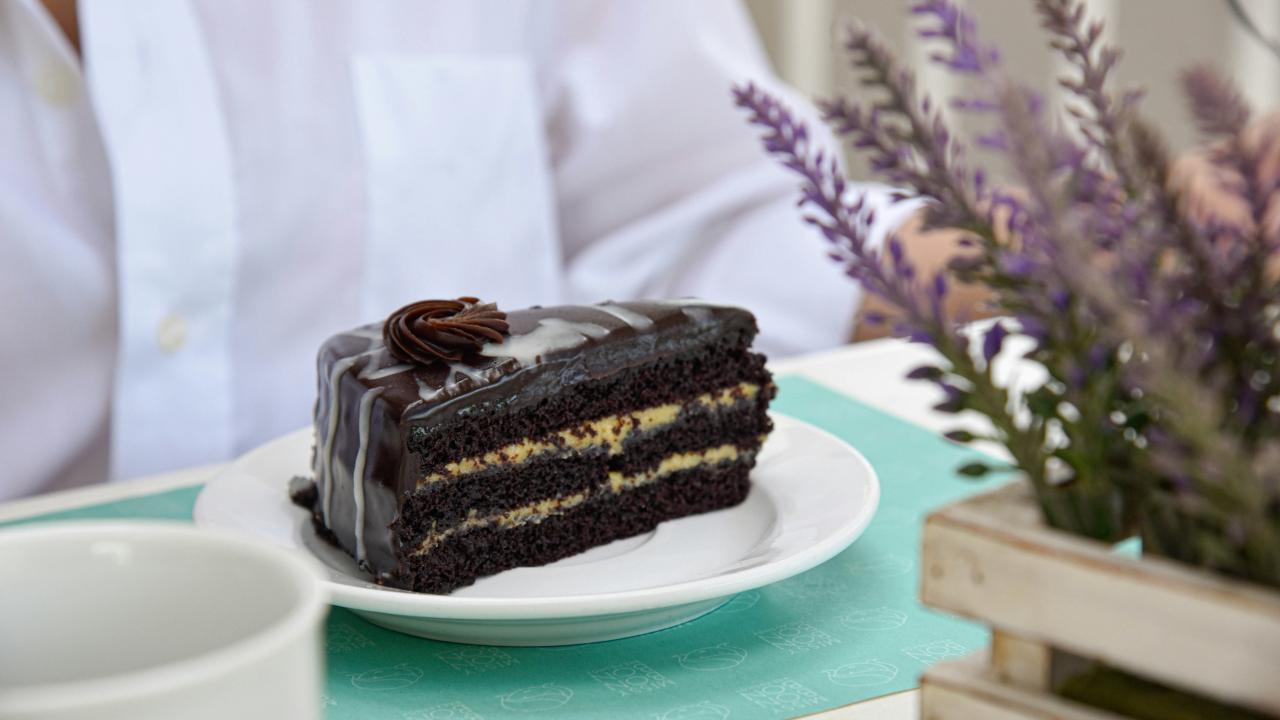 A slice of chocolate cake on a plate.