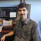 Alex Zanella Zaccaron sitting at desk 