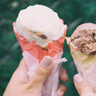 hands holding ice cream cones