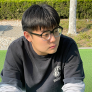 Photo of Owen Li taken outside.