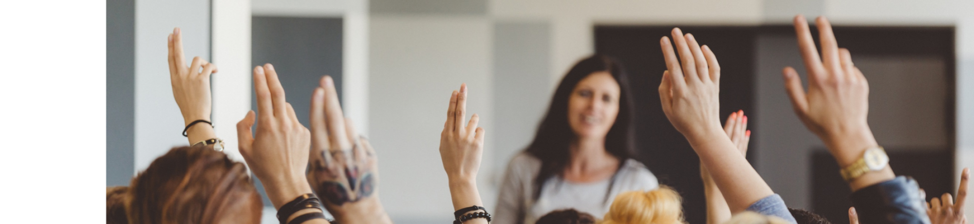 group of people with their hands raised 